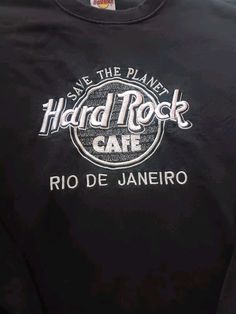 a black shirt with the words hard rock cafe on it