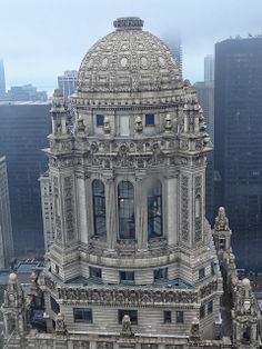 an aerial view of a large building in the city