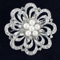 Floral brooch made from crystal Rhinestones with five pearls in the center; base plated in Silver color ; Width: 1-3/4 inches. Fabric Flower Pins, Cheap Diamond Rings, Bijoux Art Nouveau, Bridesmaid Pearls, Turquoise Jewelry Native American, Wedding Brooch, Wedding Bridal Jewellery, Pearl Brooch, I Love Jewelry