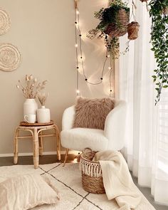 a living room with a chair, rug and lights on the wall next to it