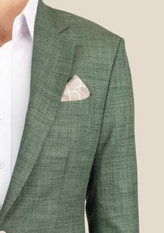 Be bold and indulge in the luxurious Aspen Green Hopsack Jacket. Custom made from a luxurious bamboo/wool/linen/silk blend from Cavani, perfect for those who want to feel bold and exude confidence in their style. Elevate your wardrobe and embrace the challenge of standing out! Luxury Linen Suits For Fall, Luxury Linen Suit For Fall, Luxury Linen Outerwear For Office, Fitted Silk Blazer With Pockets, Green Linen Outerwear With Notch Lapel, Luxury Linen Blazer For Fall, Elegant Green Silk Outerwear, Green Linen Business Blazer, Elegant Green Blazer With Pockets