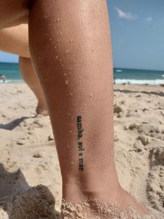 a person on the beach with their foot covered in sand and writing that reads, there is