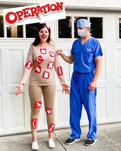 a man and woman dressed up as nurse and nurse in front of a garage door