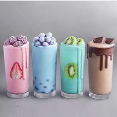 four different types of milkshakes with toppings