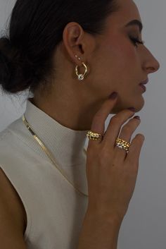 The classic gold hoop reinvented. Crafted in high polish 18K Gold vermeil with sterling silver accent, the Greyson hoops are a staple in the Hydez Essential Collection. These sophisticated head-turners will luxe up any look. Our two tone design means you’ll never have to choose between gold and silver.Materials: 18K Gold Vermeil and Sterling SilverDimensions: 20mm hoop, 3mm width What is 18K Gold Vermeil?: 3 microns of 18K Gold over Sterling Silver. Vermeil is far more durable to wear than tradi Will Turner, Classic Gold, Silver Accents, Gold Hoop, Pure Silver, Gold Plating, Gold Vermeil, Two Tone, 18k Gold