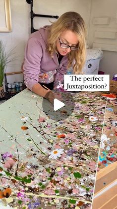 a woman in glasses is painting flowers on a table with the words, the perfect juxtaposition?