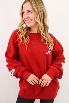 Stay warm and show your pride with our Crimson Alabama Sweatshirt! This standard crew neck sweatshirt features a script A embroidered logo on the front and a large Alabama graphic on the back. Perfect for game days or casual wear, this sweatshirt combines style and team spirit in one cozy package. Roll Tide! Crimson Alabama Sweatshirt Alabama Crimson Tide Sweatshirt Women's Alabama Crimson Tide Sweatshirt Standard crewneck sweatshirt Relaxed fitting Front chest embroidered script A logo Large Al Collegiate Team-colored Sweatshirt For Fall, College Team-colored Sweatshirt For Fall, Collegiate Sweatshirt For Game Day In Fall, Collegiate Style Sweatshirt For Game Day In Fall, College Team Name Sweatshirt For Fall, Collegiate Long Sleeve Sweatshirt For Game Day, Varsity Team-colored Sweatshirt For College, Team-colored Fall Sweatshirt With Ribbed Cuffs, Fall Team Spirit Sweatshirt With Ribbed Cuffs