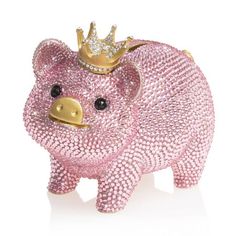 a pink pig with a gold crown on top of it's head and eyes