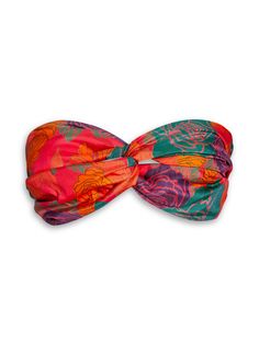 Our classic Bia bandeau is simple yet sexy. It's a stunner in our Caribbean inspired floral print. The subtle sheen of Thai silk gives these luscious colors an extra pop. A feminine and flirty soft bralette is chic staple to pair with our matching shorts or your favorite denim. Layer it under our Brizo Blouse for a lovely layered look. Hello Summer! Color: Caribe Rose 100% Thai Silk Interlocking twist front detail Soft wide elasticized band that provides support designed to fit fuller bust sizes Chic Bandeau Tube Top With Floral Print, Multicolor Floral Print Strapless Tube Top, Multicolor Strapless Floral Print Tube Top, Strapless Multicolor Floral Print Tube Top, Chic Multicolor Bandeau Tube Top, Floral Print Bandeau Tube Top For Party, Elegant Pink Bandeau Tube Top, Pink Floral Print Strapless Tube Top, Luxury Resort Wear