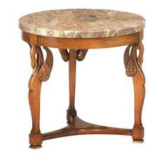 an antique wooden table with marble top