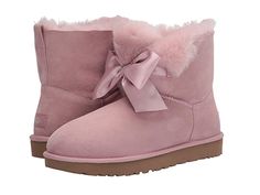 UGG Gita Bow Mini Boot (Pink Crystal) Women's Pull-on Boots A cute little gift of a boot. Pull-on mini boot in twinface sheepskin with a sueded upper and fur lining. Fixed satin bow adorns the front. UGGpureâ? wool insole. Polyester binding. Lightweight and flexible Treadlite by UGGâ? outsole. Real sheep or lamb fur from Australia Ireland the United Kingdom or the United States is artificially dyed and treated. Imported. Measurements: Heel Height #UGG #Shoes #Boot #CasualPull-on #Pink Ugg Boots With Bows, Expensive Outfits, Cute Uggs, Womens Ugg, Pink Uggs, Outfits Dressy, Pink Boots, Fresh Shoes, Pull On Boots