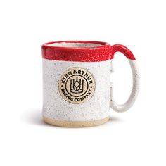 a red and white coffee mug with the words king & country on it