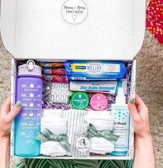 someone is holding up a box full of personal care items