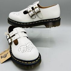 (eBay) Find many great new & used options and get the best deals for Dr. Martens Mary Jane Sz 6 White8065 Smooth Leather Maryjane Shoes AirWair T-Bar at the best online prices at eBay! Free shipping for many products! White Leather Shoes With Round Toe And Leather Footbed, White Leather Shoes With Flat Heel And Leather Footbed, White Flat Leather Shoes With Removable Insole, White Leather Shoes With Perforations And Round Toe, White Leather Shoes With Perforations, Doc Marten Mary Janes, Dr Martens Mary Jane, Pretty Princess, Strap Shoes