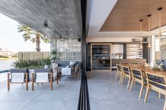 an outdoor dining area with tables and chairs