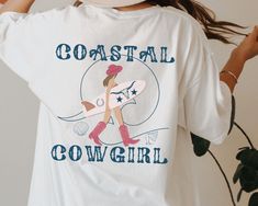 Coastal Cowgirl Comfort Colors Coconut Girl T shirt Cowgirl Aesthetic Cow Skull Shirt Nashville Shirts Cowgirl Bachelorette Midwest Shirt 🖤 For oversized order 1-3 sizes up, refer to listing photos for sizes 🖤 Comfort Colors 1717 Comfort Colors introduces its garment-dyed t-shirt; a fully customizable tee made 100% with ring-spun cotton. The soft-washed, garment-dyed fabric brings extra coziness to your wardrobe while the relaxed fit makes it an excellent daily choice. The double-needle stitch Coastal Cowgirl Graphic, Nashville Shirts, Coast Cowgirl, Coastal Cowgirl Bachelorette, Midwest Shirt, Aesthetic Cow, Coastal Cowboy, Craft Shed