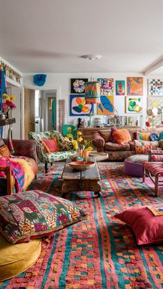 a living room filled with lots of colorful furniture