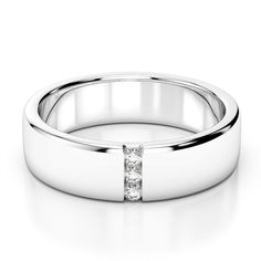 a white gold wedding ring with two princess cut diamonds on the side and a diamond set in