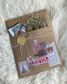 a brown box with some pictures on it and flowers in the bottom right hand corner