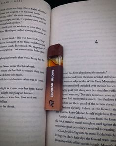 an open book with a lighter in it