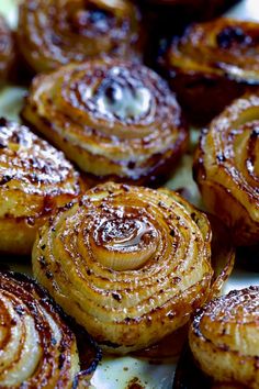 baked onions with cinnamon on top and the title reads roasted onions muffin pan method