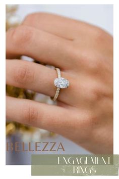 a woman's hand with a ring on her finger and the words belezza