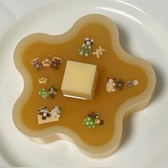 a white plate topped with lots of different types of food on top of it's surface