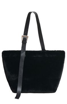 This slouchy tote is made of supersoft faux fur and has an interior zip pocket to keep your essentials organized. Magnetic-snap closure Adjustable shoulder strap Interior zip pocket Faux-suede lining 100% recycled polyester faux fur Spot clean Imported Fur Tote Bag, Slouchy Tote, Adjustable Belt, Womens Tote Bags, Leather Trims, Snap Closure, Faux Suede, Zip Pockets, Faux Fur