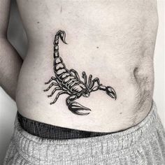 a man with a scorpion tattoo on his stomach