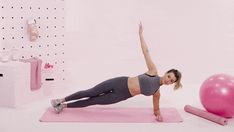 a woman is doing exercises on a pink exercise mat with an exercise ball in the background