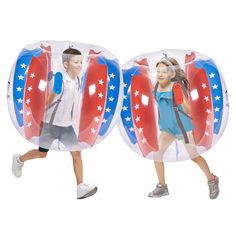 two children are running through an inflatable bubble with stars and stripes on it