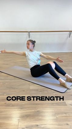 a woman in white shirt and black leggings on yoga mat with text core strength