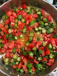 a pan filled with chopped tomatoes and green peppers