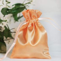 "View All Colors : https://etsy.me/3li6E8D Quantity: 12 Satin Bags Material: Satin Color: Peach Height: 4\" Width: 3\" Thickness: 90 GSM Fillable Size: 3\" x 3.5\" Perfect for packaging jewelry, candies, or gifts. Drawstring Pouch Wave like modish pattern coupled with rustic burlap hue and texture give these favor bags a classic whimsical appeal. Pack wine bottles, decorative jars or pots, pillar candles, and other sweet surprises and secure with two double pull ribbon knots at the end for safe- Favor Table, Burlap Gift Bags, Satin Pouch, Spring Wedding Decorations, Handmade Candy, Candy Party Favors, Candy Jewelry, Wedding Gift Bags, Muslin Bags