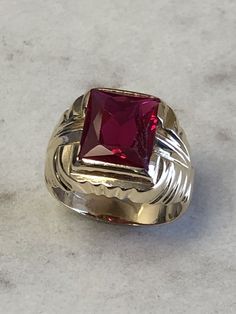 A Classic Mens 14kt Yellow Gold Mens Red Spinel Octagon Shape bezel set in fashion style ring. Finger size 8. total weight is 7.5 grams. This item would Retail for $895.00 Heirloom Red Signet Ring With Polished Finish, Formal Ruby Signet Ring With Bezel Setting, Ruby Signet Ring With Bezel Setting For Formal Occasions, Heirloom Red Gold Signet Ring, Classic Red 14k Gold Signet Ring, Classic 14k Gold Red Signet Ring, Red 14k Gold Signet Ring, Formal Red Rings With Bezel Setting, 14k Gold Red Signet Ring For Anniversary