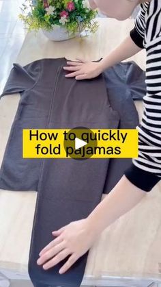 a woman is placing her hand on the back of a piece of clothing