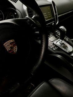 the steering wheel and dashboard of a car