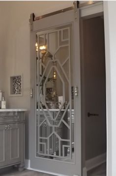 an ornate glass door in a bathroom