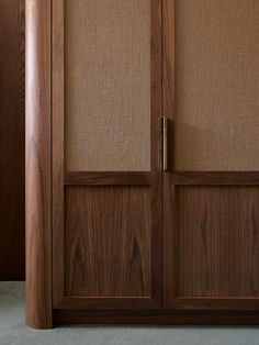 a close up of a wooden door with some fabric on the top and bottom panels