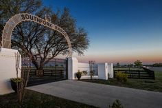 the entrance to south texas ranch at sunset