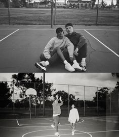 two men sitting on top of a tennis court