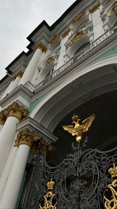 an ornate building with gold and white decorations