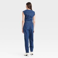 Add this Tailored Denim Jumpsuit from Universal Thread™ to your everyday wardrobe for putting together a variety of chic outfits. Made of recycled cotton, this denim jumpsuit is fashioned in a crewneck style with a zipper for easy on and off. This sleeveless jumpsuit boasts two front pockets and two back pockets to keep your essentials close at hand and also features belt hoops for versatile wear. Universal Thread™: Found exclusively at Target. Casual High Rise Jumpsuits And Rompers For Work, Casual High-rise Jumpsuits And Rompers For Work, High Rise Cotton Denim Jumpsuit For Work, High-waisted Cotton Denim Jumpsuit For Work, Cotton High-rise Jumpsuits And Rompers For Work, Spring High Rise Denim Jumpsuit For Work, Fitted Cotton Denim Overall Jumpsuit, High Waist Denim Jumpsuit For Spring Workwear, Fitted Sleeveless Denim Jumpsuit For Work