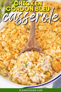 chicken cordon bleu casserole in a white dish with a wooden spoon