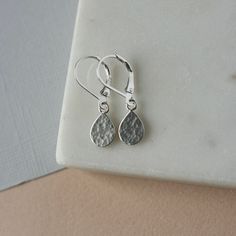 Hammered Sterling Silver Teardrop Earrings - Small Dainty Dangle Lever back Earrings  These earrings are great jewelry staples and perfect for everyday wear. They feature sterling silver lever backs and dainty sterling silver teardrops. The teardrops are 8mm wide and 12mm long (including the loop) and they have a hammered texture for a nice bright shine. The teardrops are lightweight and the lever backs ensure the earrings are secure and comfortable. The earrings hang about an inch from top to b Dainty Teardrop Earrings For Everyday, Minimalist Dangle Teardrop Earrings, Minimalist Teardrop Dangle Earrings, Dainty Teardrop Dangle Earrings For Everyday, Dainty Everyday Teardrop Dangle Earrings, Everyday Minimalist Teardrop Dangle Earrings, Minimalist Hypoallergenic Drop Earrings For Everyday, Minimalist Teardrop Single Drop Earring, Minimalist Single Teardrop Earring