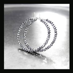 Sparkly, dainty and lightweight round hoop earrings featuring tiny (1.5-2.5mm) faceted 'antique silver/metallic gray' crystals strung unto 21 gauge .925 Sterling Silver wire. You have a choice of 20mm, 30mm, 45mm, 55mm, 65mm or 75mm diameter hoops. More HOOP EARRINGS, in my shop: https://www.etsy.com/shop/DorotaJewelry?ref=hdr_user_menu-shop&section_id=28150357 --- All of the designs in my shop are handmade by me in my Virginia studio. Elegant GIFT BOX is included with your order YOU CAN ENTER MY SHOP HERE: http://www.etsy.com/shop/DorotaJewelry Copyright © 2024 Dorota Sularczyk. All Rights Reserved. Gray Crystals, Crystal Hoop Earrings, Czech Crystal, Beaded Hoops, Silver Crystal, Silicone Beads, Jewelry Earrings Hoops, Elegant Gift, Minimalist Jewelry