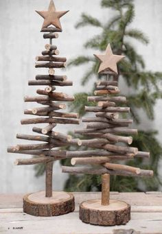 a small wooden christmas tree sitting on top of a table