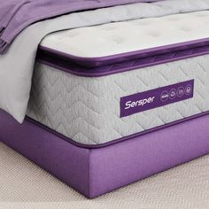 the purple mattress is laying on top of the bed