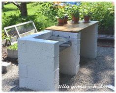 an outdoor table and bench made out of cinder blocks