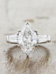 Marquis Diamond, Baguette Side Stones, Three Stone Diamond Engagement Ring, Gold Diamond Wedding Rings, Classic Engagement Ring Solitaire, Three Stone Diamond Rings Engagement, Marquise Diamond Engagement Ring, Marquise Diamond Ring, Engagement Ring Inspiration